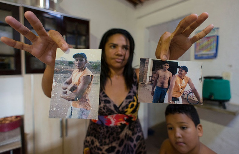  Gerlene Santos holds photos of her late husband, Vanderlei Matos da Silva (left), who died after exposure to pesticides in his job at a pineapple plantation run by Fresh Del Monte. A court recently upheld a $110,000 award in her favor over his death. REUTERS/Davi Pinheiro