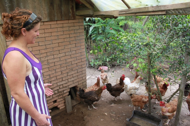 woman and chickens